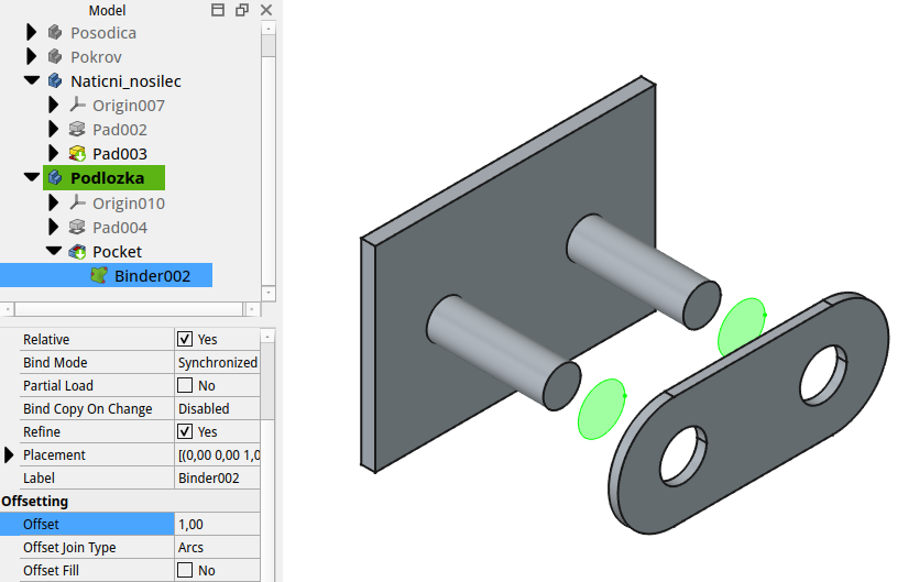 Primer uporabe Sub-Shape Binder (zeleno obarvani ploskvi) orodja pri načrtovanju podložke za natični nosilec. Sub-Shape Binder je povezan na čelni ploskvi nosilcev, dodeljen mu je 1 mm relativni odmik in nato uporabljen za izdelavo lukenj v podložki.