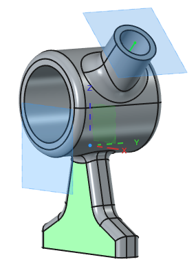 Dva primera uporabe referenčne ravnine (modro), ki smo jih postavili relativno na izbrane geometrijske elemente (zeleno)